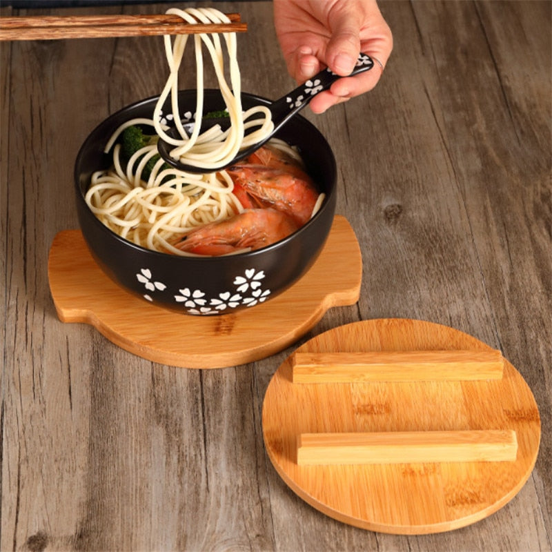 pottery bowls with lids, spoons and chopsticks, rice bowls of noodles and rice, soups, salads, tableware and food containers.